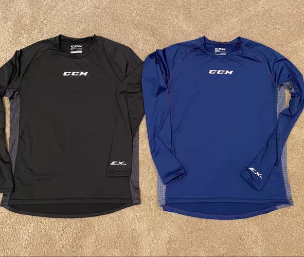 (2) CCM BASE LAYER MEDIUM SHIRTS (PRICE IS FOR BOTH)