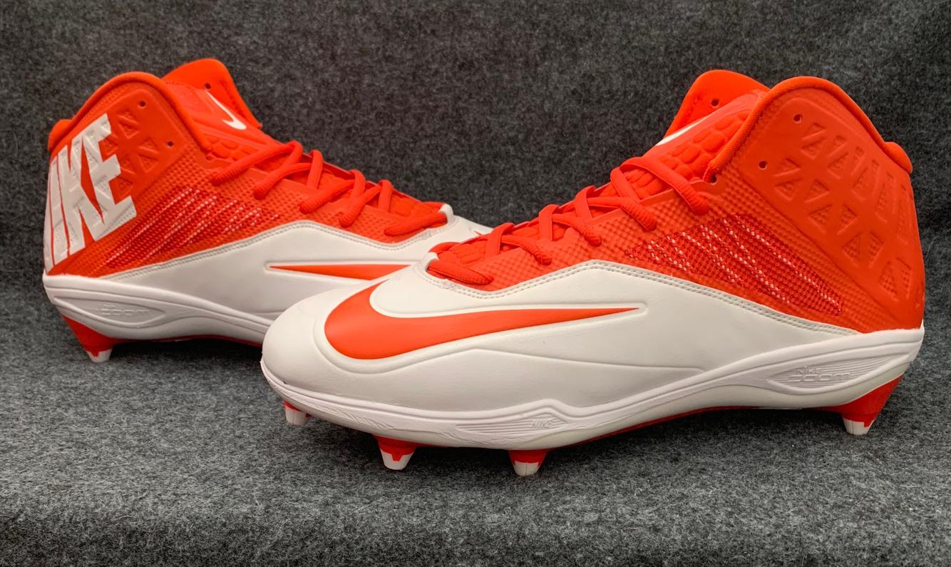 orange and white nike football cleats