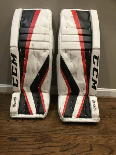 Black/Red/White Used Junior 30" CCM revolution 595 Goalie Leg Pads