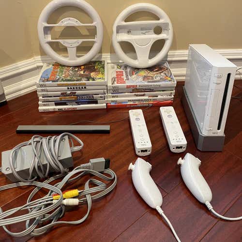Nintendo Wii Console with an assortment of games