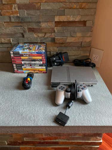 Used PlayStation 2 with games