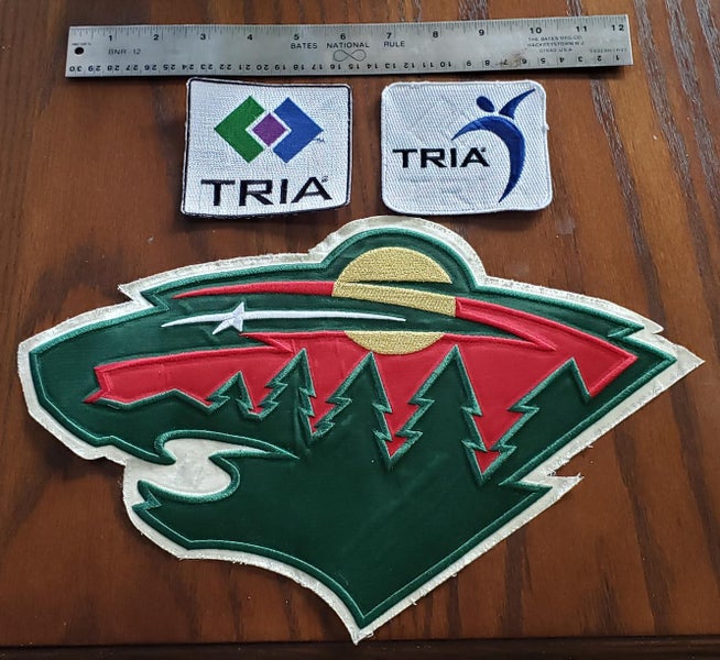 Used Reebok Minny Wild Crest and sponsorship patches
