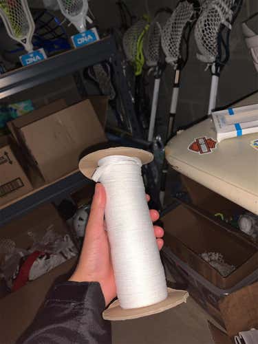 White shooting string spool