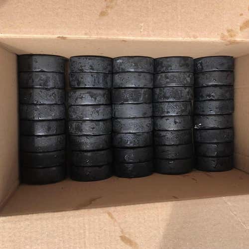 40 Used Hockey Pucks
