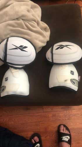 New Senior Reebok Shoulder cap and protectors.