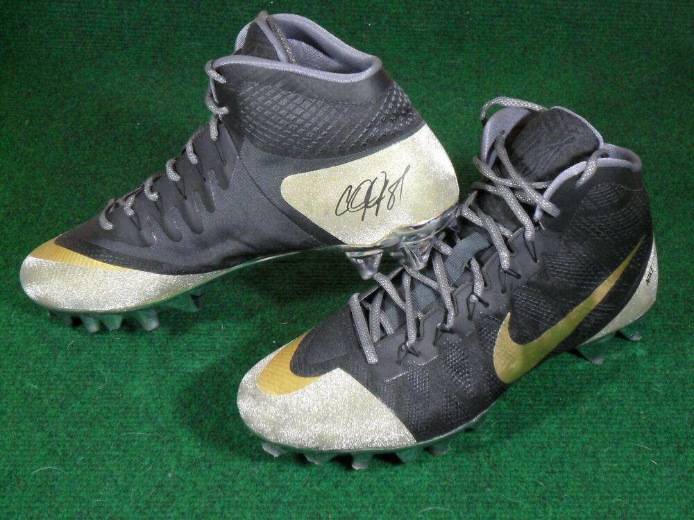 green and gold nike football cleats