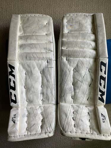White Used Junior 26+1" CCM Extreme Flex E3.5 Goalie Leg Pads