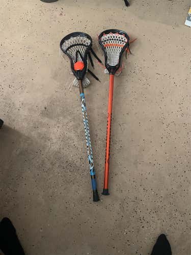 2 Lacrosse Sticks And A Ball