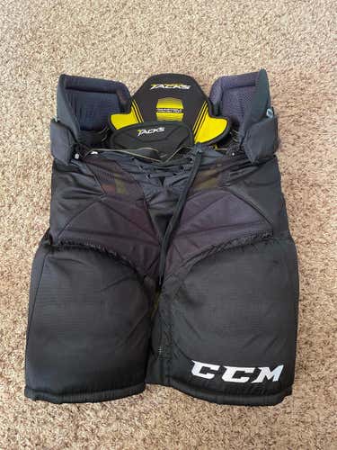 Black CCM Supertacks Player Pants. ( Good Condition)
