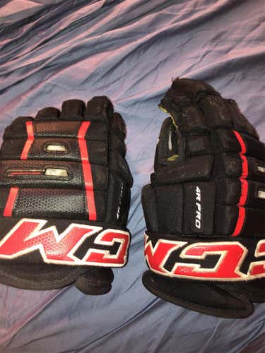 Black Used CCM Tacks 4 Roll Pro 13"  Gloves