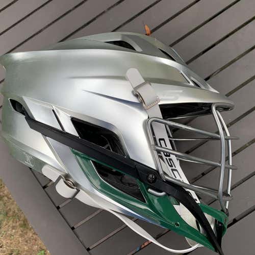 Lightly Used Cascade S. Platinum Shell, Green Jaw, Chrome Cage. White Strap. Decal Removable.