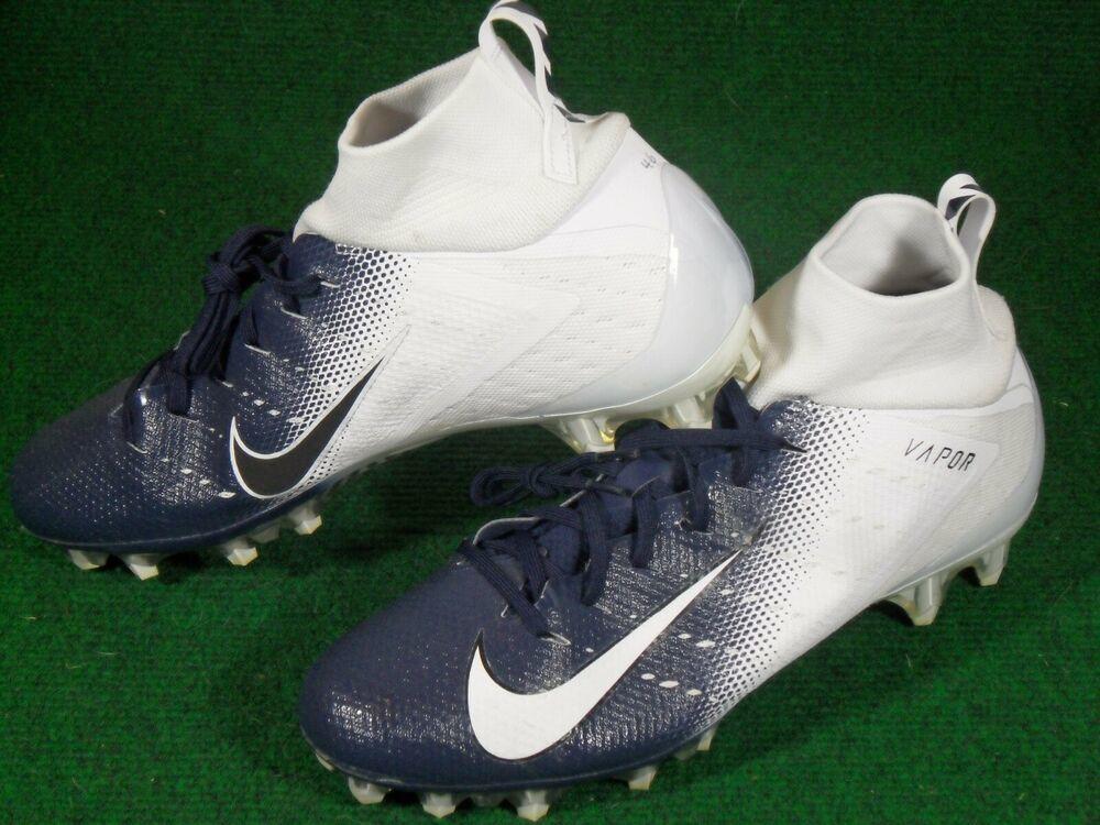 navy blue and white nike cleats