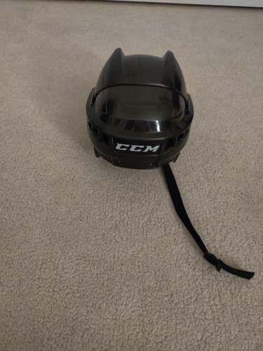 Used black CCM 04 xs hockey helmet