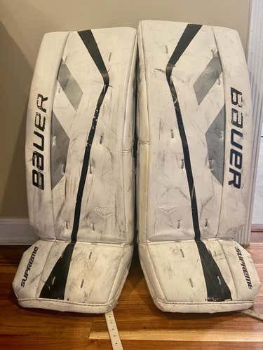 White Used Junior 28" Bauer Supreme One.5 Goalie Leg Pads