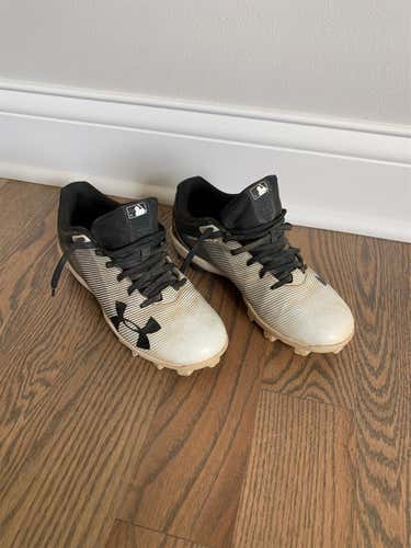 Kid’s Under Armour Black and White Cleats