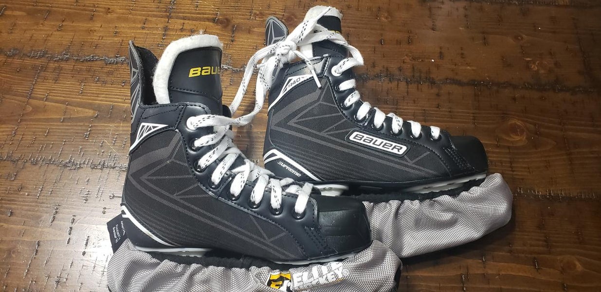 Barely Used Junior Bauer Supreme Hockey Skates Size 4 with covers
