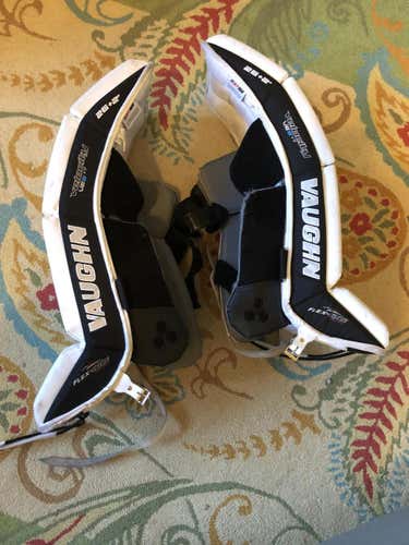 White Used Youth 26 + 2" Vaughn Velocity VE8 Goalie Leg Pads - YT with bungie toe attachment added