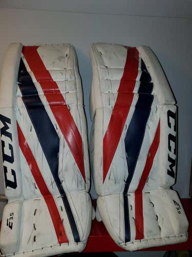 White Used Junior 28" CCM Extreme Flex E3.5 Goalie Leg Pads