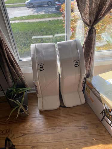 White Used Senior 35" Warrior Goalie Leg Pads Pro Stock