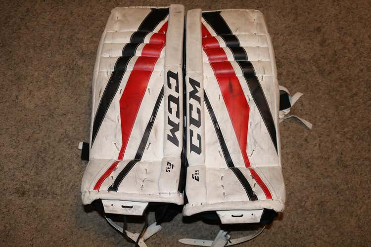 White Used Junior 26" CCM Extreme Flex E3.5 Goalie Leg Pads