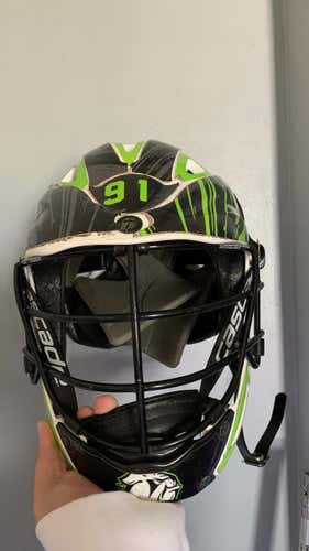 White Used Youth Player's Cascade CS Youth Helmet with green and black wrap.