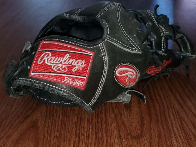 Black Used Adult Rawlings Right Hand Throw Infield Heart of the Hide Baseball Glove 11.75"