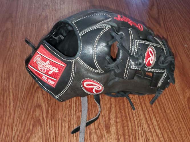 Black Used Adult Rawlings Right Hand Throw Infield Heart of the Hide Baseball Glove 11.25"