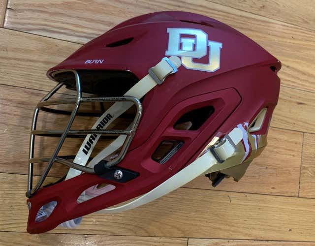 Team Issued Denver Pioneers Warrior Burn Helmet. Red Shell, GoldCage, Team Decals. Medium. Used