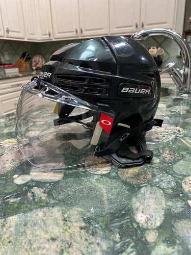 Black Used Medium Bauer Re-Akt 75  Helmet