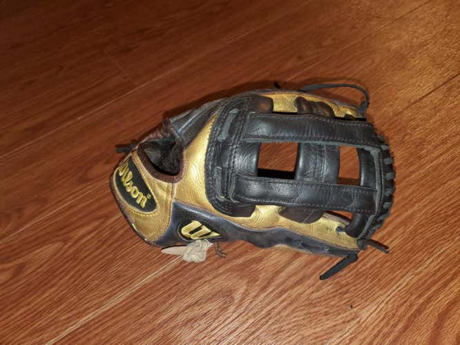 Gold and Black Used Adult Wilson Right Hand Throw Infield A1000 Baseball Glove 11.75"