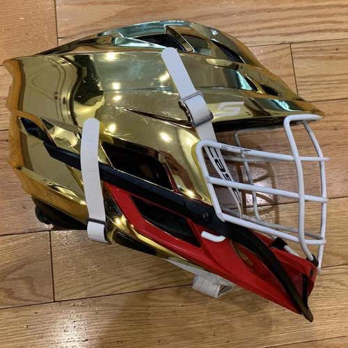 used Cascade S. gold chrome shell, white cage & strap, red jaw. osfm.