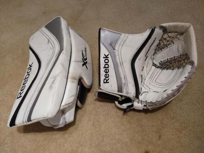 Pair of White, Silver and Black Used Senior Reebok Regular XLT28 catcher and blocker