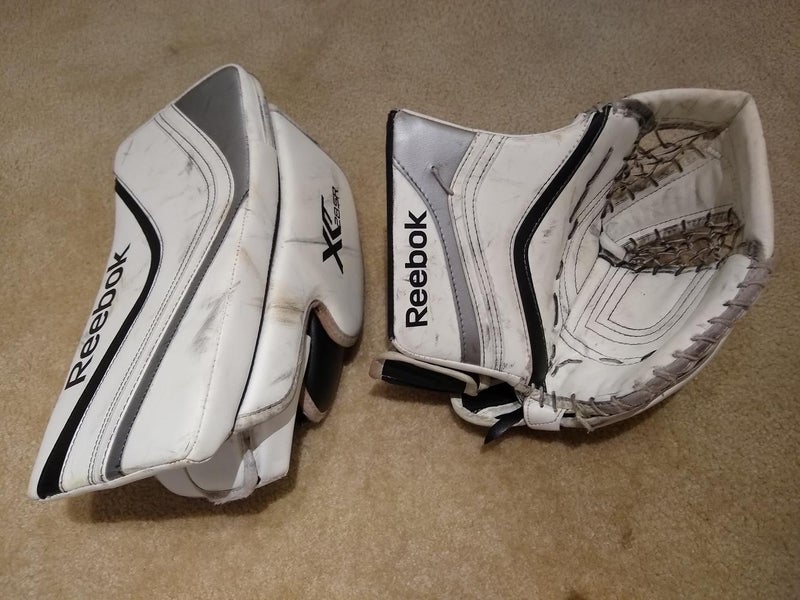Pair of White, Silver and Black Used Senior Reebok Regular XLT28 catcher and blocker