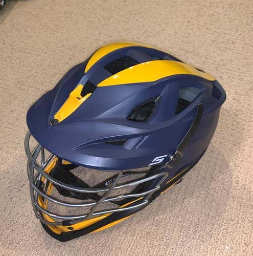 Used Cascade S. Matte Navy shell, chrome cage, yellow gold chin & washer, black strap. M/L. osfm