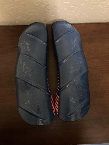 2019 Shred medium navy blue/rust shin guards.