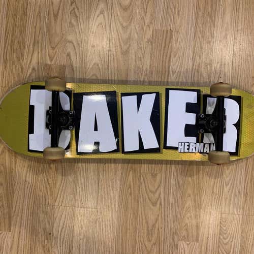 Gold Skateboard Deck With Trucks And Wheels
