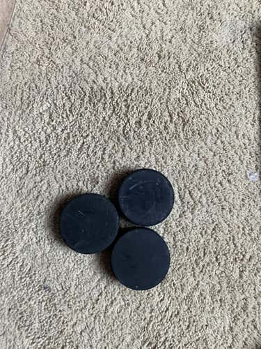 3 Used Hockey Pucks - good condition