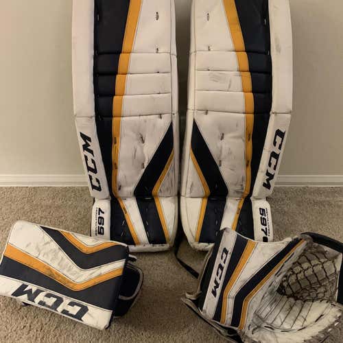 White/navy/yellow CCM Revolution 597 32+1”