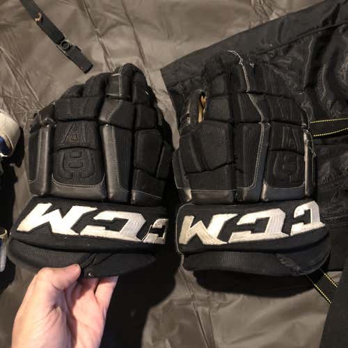 Black Senior CCM U+ Crazy Light 14" Pro Stock Gloves