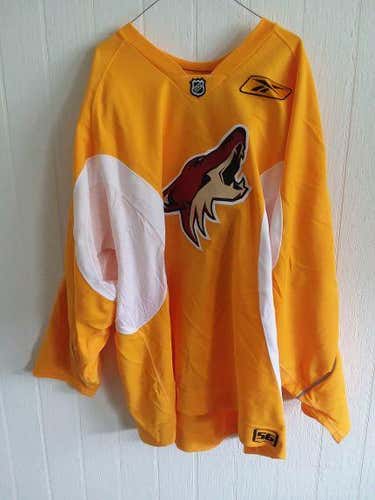 Phoenix Coyotes unused gold #68 Reebok practice jersey size 56 (everything sewn on) from 2009-2011