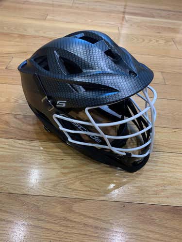used. cascade S helmet  carbon fiber finish. white cage. black chin & washer. black chin strap.