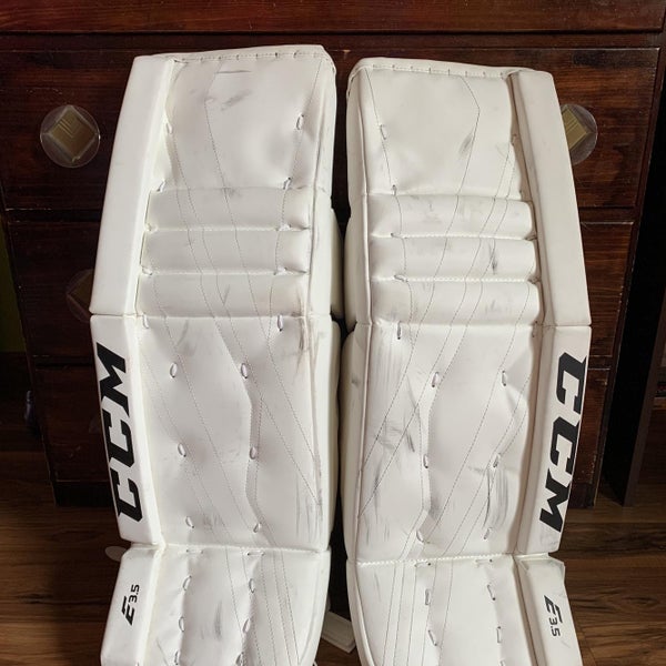 White Junior 30" CCM Extreme Flex E3.5 Goalie Leg Pads