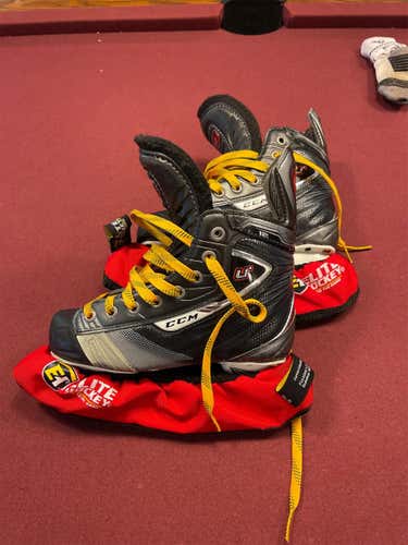 Junior CCM U+ Crazy Light Regular Width Size 1.5 Hockey Skates