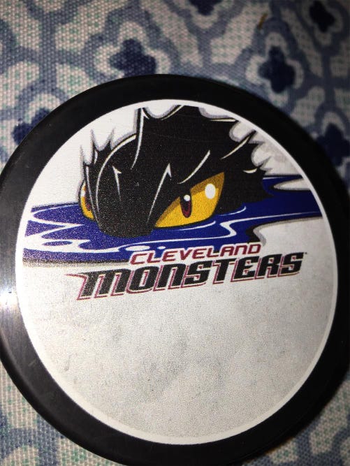 CLEVELAND MONSTERS A.H.L . HOCKEY PUCK -
