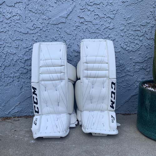 White Youth 22" CCM Extreme Flex E3.5 Goalie Leg Pads