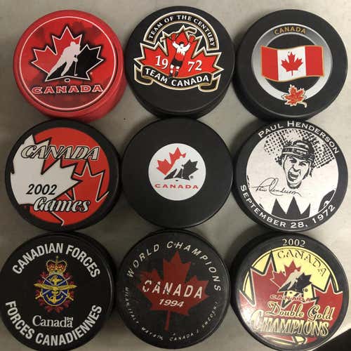 New Assorted Canadian Hockey Pucks