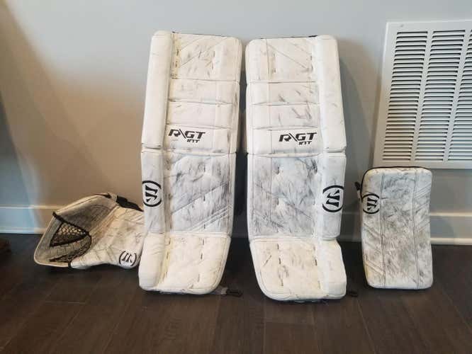 White Used Intermediate 31" Warrior Regular Ritual GT pads and G3 glovesGoalie Full Set