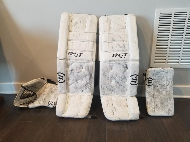 White Used Intermediate 31" Warrior Regular Ritual GT pads and G3 glovesGoalie Full Set