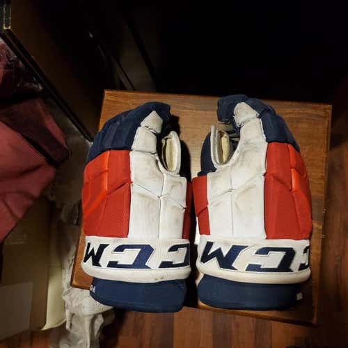 Red. White and blue (NYR) Used Senior CCM Pro Model Gloves 15"