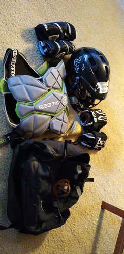 Used black Nike bag with YOUTH lacrosse equipment